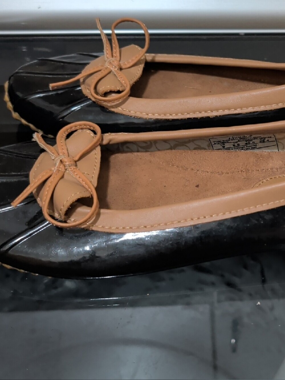 chooka Black Patent Ballet Flats with Tan Bow Trim